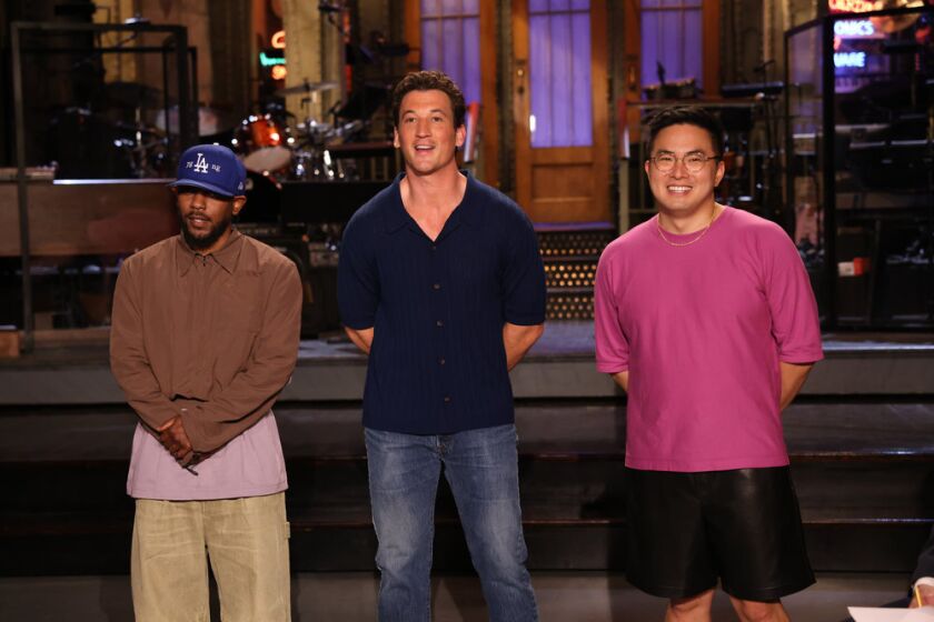 Musical guest Kendrick Lamar, from left, host Miles Teller, and 'Saturday Night Live' cast member Bowen Yang.