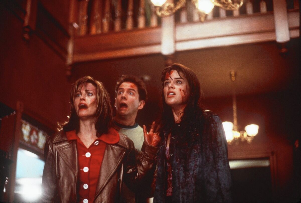 Courteney Cox, left, Jamie Kennedy and Neve Campbell in 1996's "Scream."