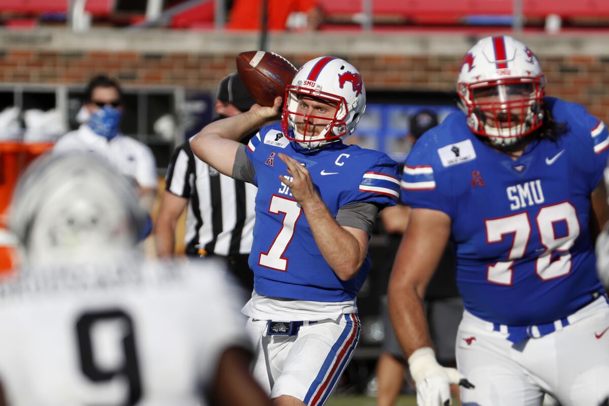 SMU quarterback Shane Buechele (7) throws a pass during the second half of an NCAA college football game against Memphis in Dallas, Saturday, Oct. 3, 2020. (AP Photo/Roger Steinman)