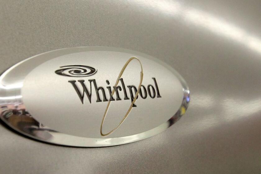 FILE - In this July 20, 2009 file photo, the Whirlpool logo appears on the face of a refrigerator for sale at the Sears Grand store in Solon, Ohio. Whirlpool said Friday, Aug. 28, 2009, it will cut 1,100 jobs and close a refrigerator factory in Evansville, Ind. (AP Photo/Amy Sancetta, file) ORG XMIT: NYBZ156 ORG XMIT: CHI0908280953171085