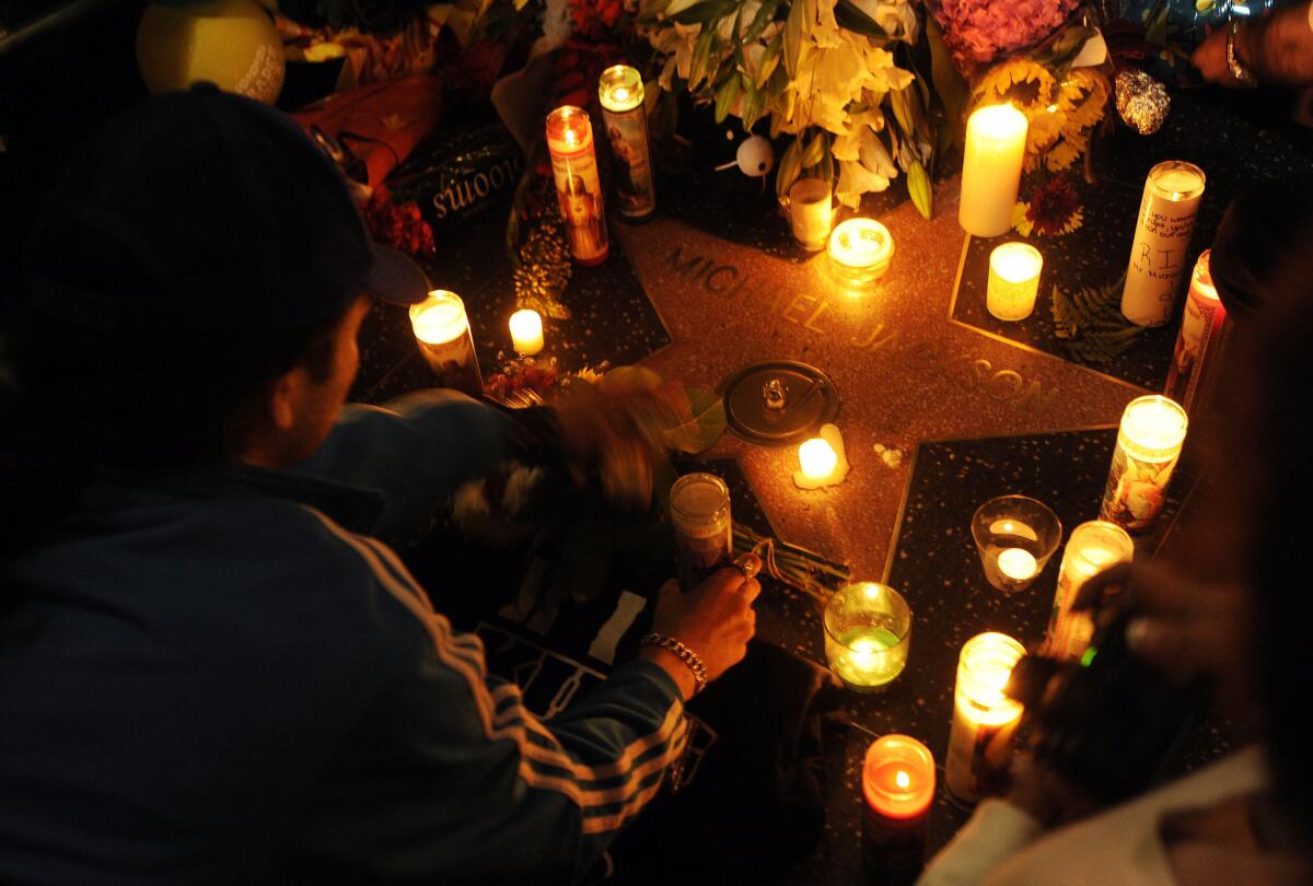 Michael Jackson fans gather around his star on the Hollywood Walk of Fame on June 26, 2009.