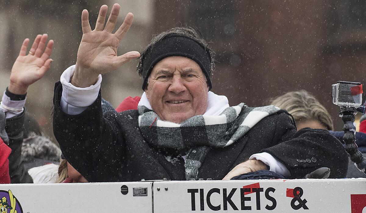 New England Patriots Coach Bill Belichick waves to the crowd during the team's Super Bowl victory parade on Feb. 7 in Boston.