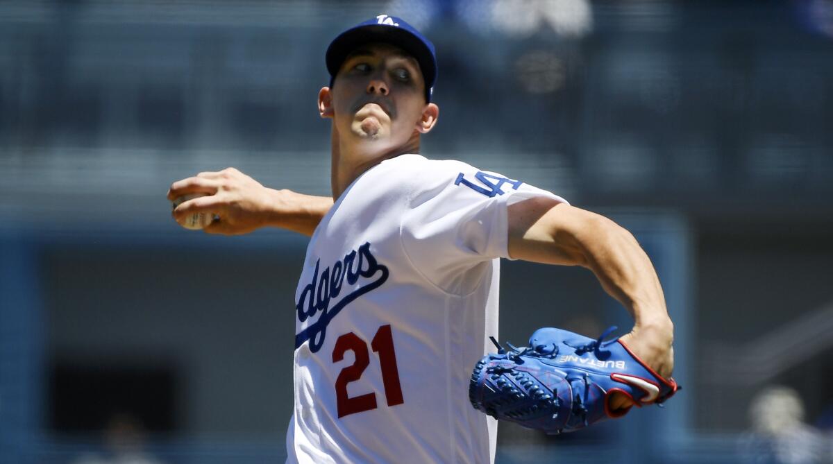 Dodgers starter Walker Buehler delivers during the first inning of the Dodgers' victory over the Miami Marlins at Dodger Stadium on Sunday.