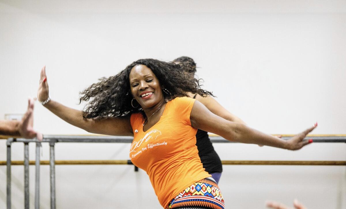 Dianne Shorte swings into action in a dance fitness class at Debbie Allen Dance Academy.