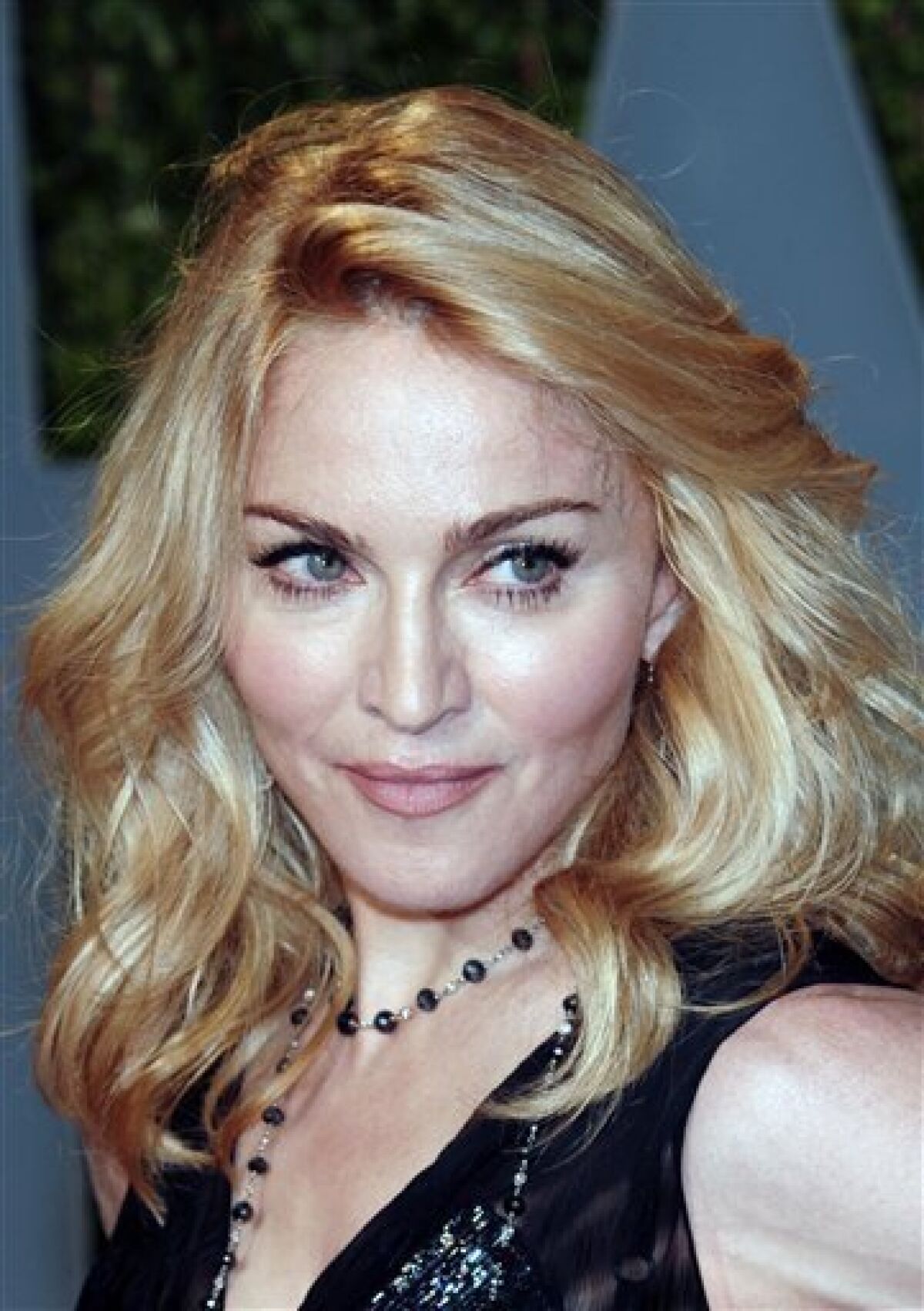 FILE - In this Feb. 22, 2009 file photo, Madonna arrives at the Vanity Fair Oscar party , in West Hollywood, Calif. The father of a girl from Malawi whom Madonna hopes to adopt says he's capable of taking care of his daughter. Madonna's appeal of a court ruling denying her request to adopt the girl is to be heard Monday, May 4, 2009, in Malawi. (AP Photo/Evan Agostini, file)