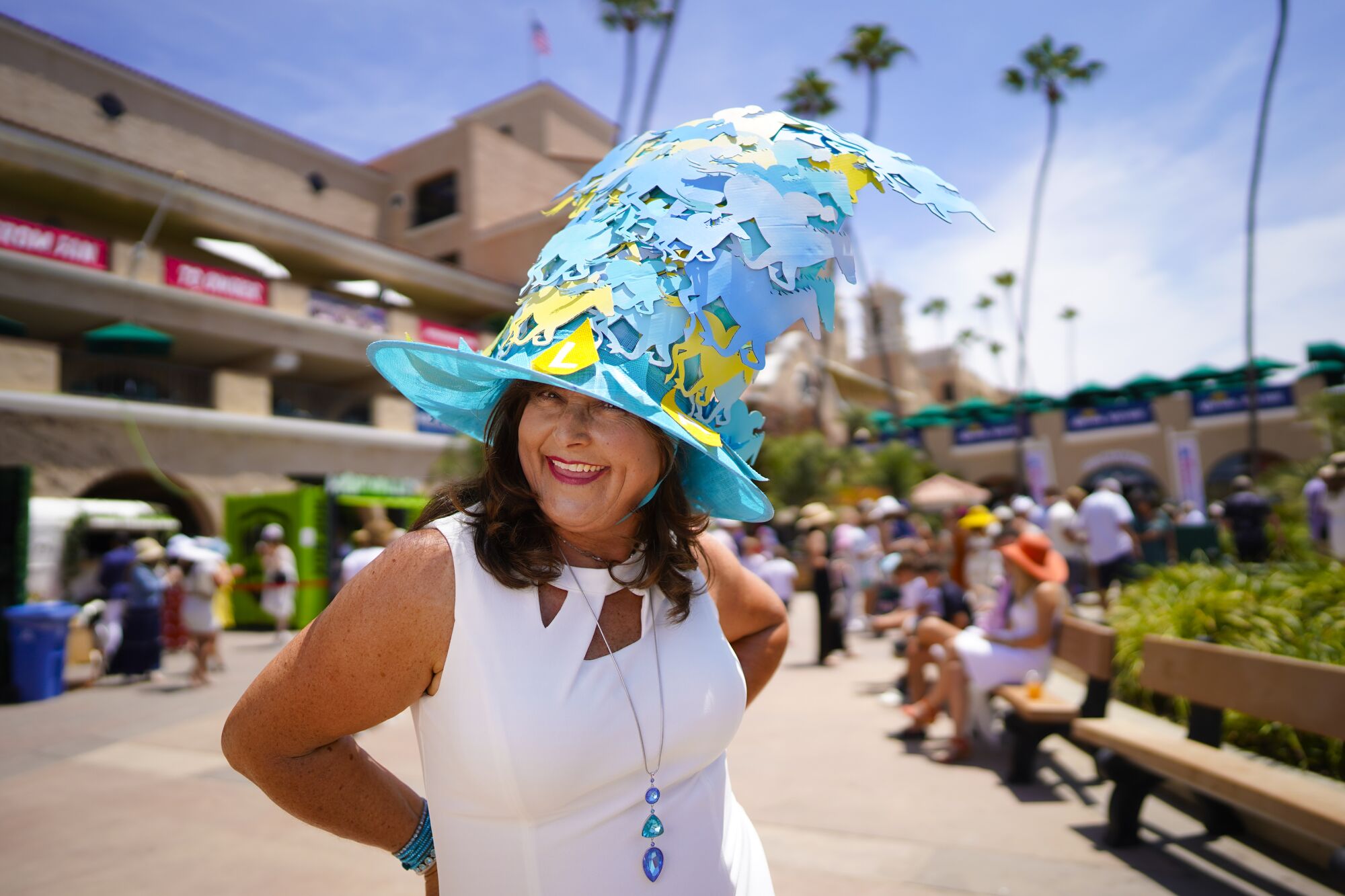Lori Shelton from Scripps Ranchwas among the race fans taking part in the tradition of wearing hats on opening day.