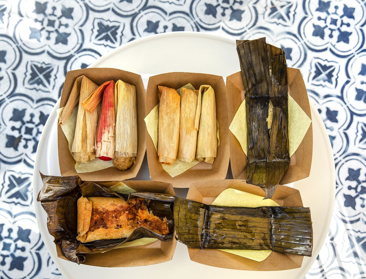 Tamales wrapped in corn husks and banana leafs at Tamales Elena Y Antojitos.