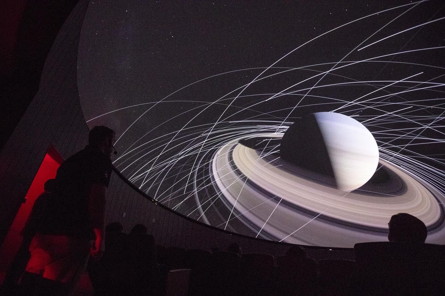 Director Scott Mitchell, left, gives a presentation Wednesday to members of the media at Orange Coast College's new planetarium, which is scheduled to open to the public March 23.