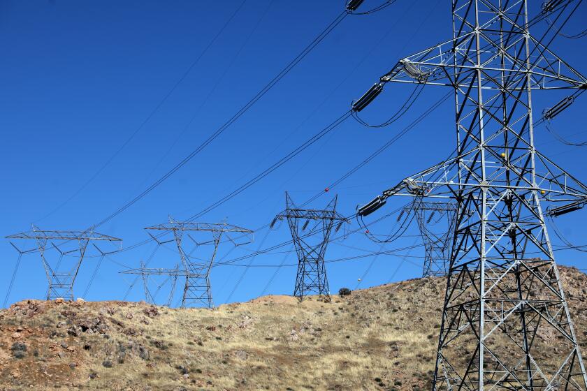 PALMDALE, CA - FEBRUARY 04: Path 26 electric transmission lines along a power corridor connecting to a capacitor rack at Southern California Edison's Vincent Substation on Thursday, Feb. 4, 2021 in Palmdale, CA. (Gary Coronado / Los Angeles Times)
