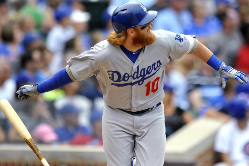 Los Angeles Dodgers' Justin Turner hits a triple during the seventh inning against the Chicago Cubs on June 25, 2015.