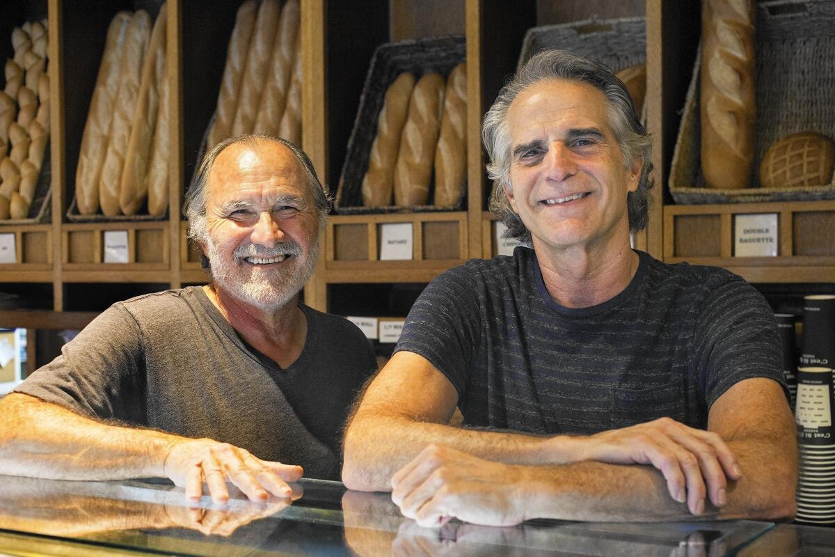 Co-owners Paul Kohne, right, and Bruno Campos founded C'est Si Bon Bakery in 1979 and became the first bakery in Newport Beach to introduce French baguettes, croissants and cafe lattes to the city.