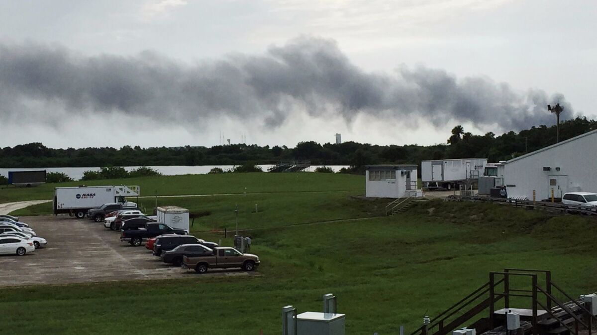 Smoke rises from a SpaceX launch site at Cape Canaveral, Fla., after a rocket explosion in September.