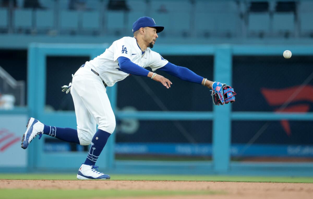 Mookie Betts can't reach a single by Randal Grichuk in the second inning Wednesday.