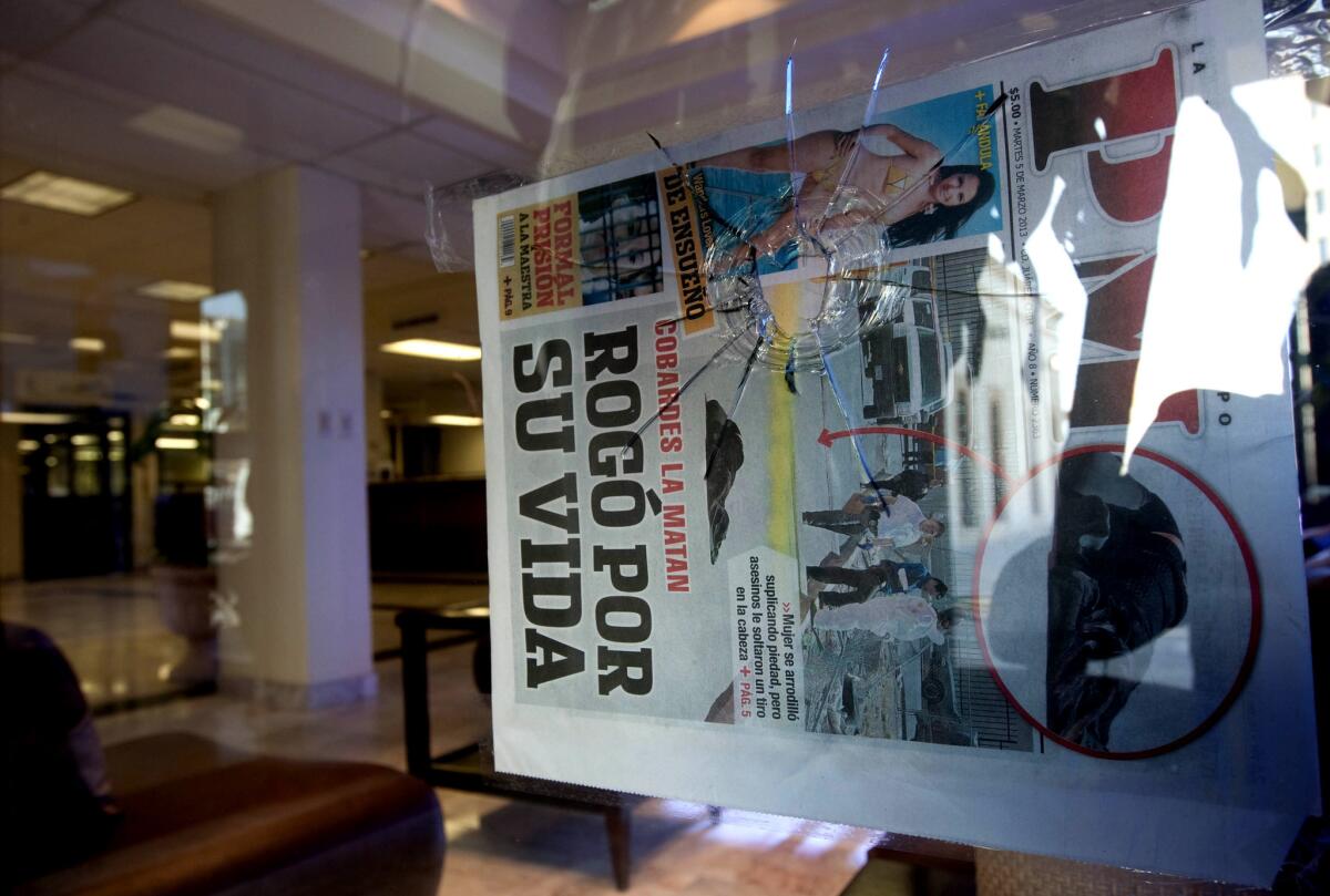 A bullet hole is visible in a window of the offices of El Diario de Juarez newspaper in Ciudad Juarez, Mexico.