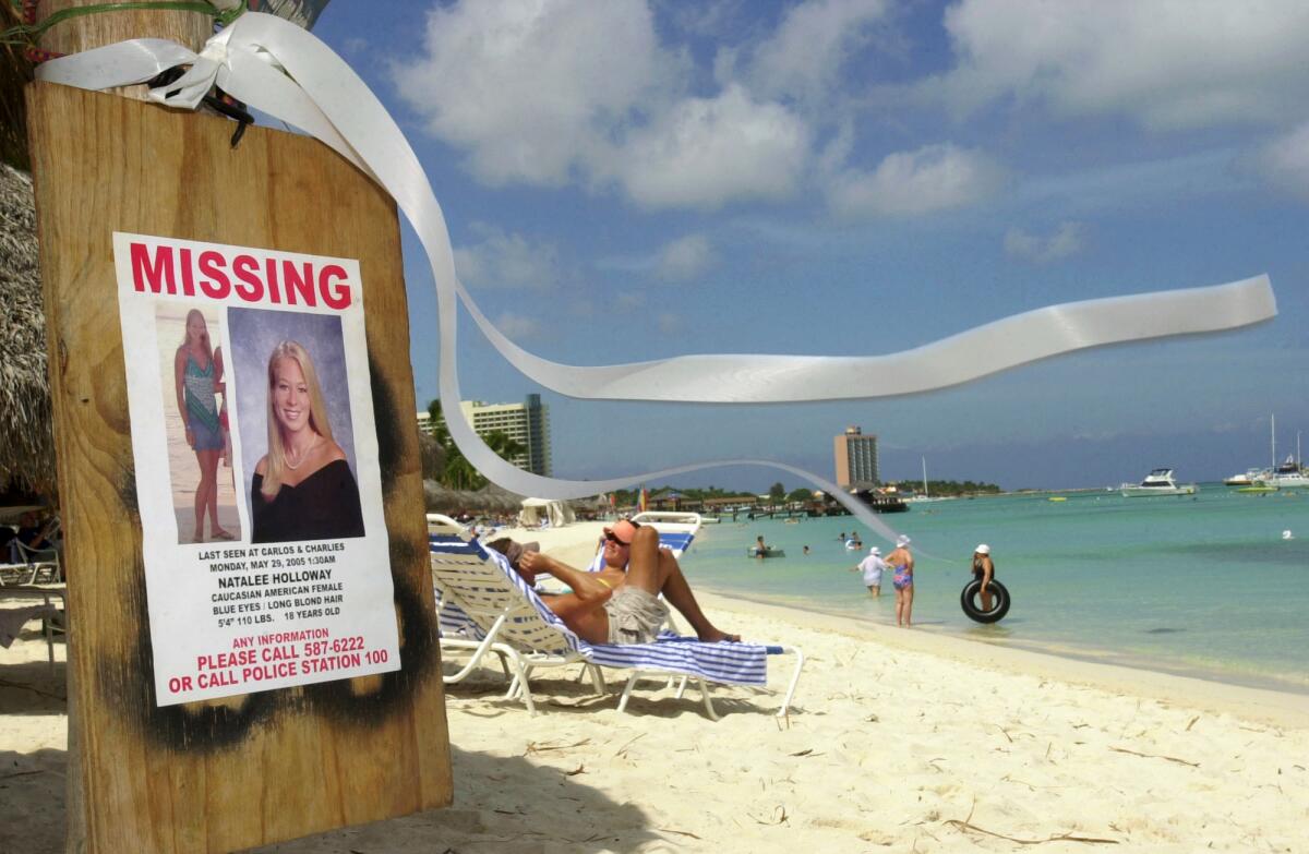 A poster of missing American student Natalee Holloway on a beach in Aruba