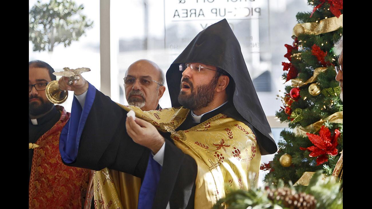 Very Rev. Father Torkom Donoyan celebrates Armenian Christmas during brief ceremony at Dignity Health Glendale Memorial Hospital, in Glendale on Friday, Jan. 5, 2018. A large crowd attended the event, including local officials and administrators.