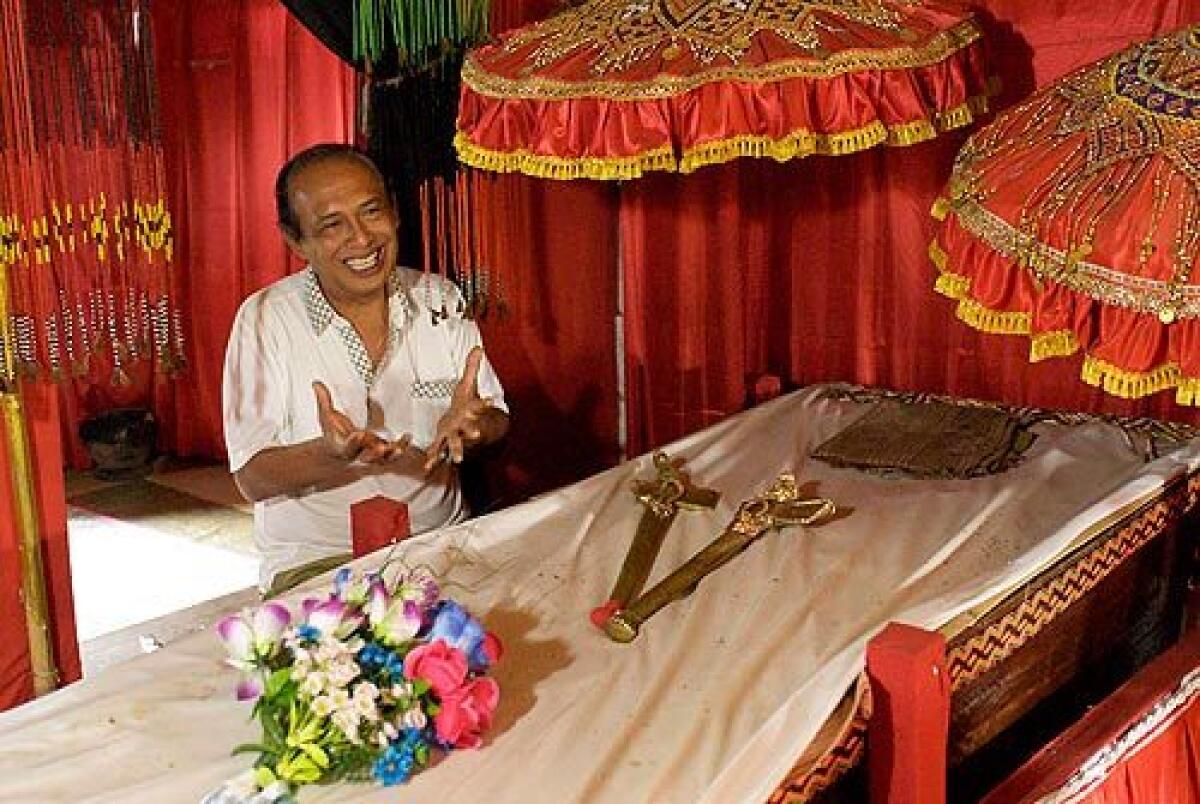 The mummy of the last king of Toraja, Puang Sambolinggi, has waited in this coffin for five years while the king's son, Eddy Sambolinggi, 56, and other family members negotiate details of the late monarch's elaborate funeral. More photos >>>