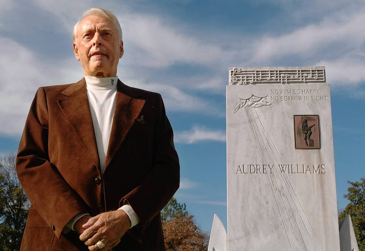 Charles Carr in 2007 at the graves of Hank and Audrey Williams in Oakwood Cemetery in Montgomery, Ala.