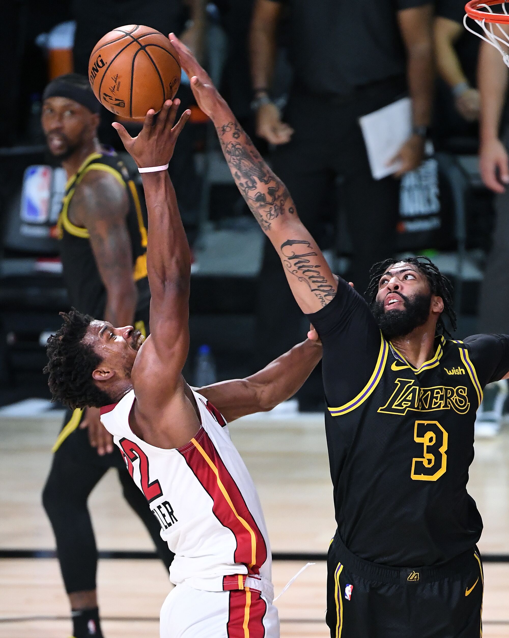 Lakers forward Anthony Davis blocks a shot by Miami Heat forward Jimmy Butler during the first quarter of Game 5.