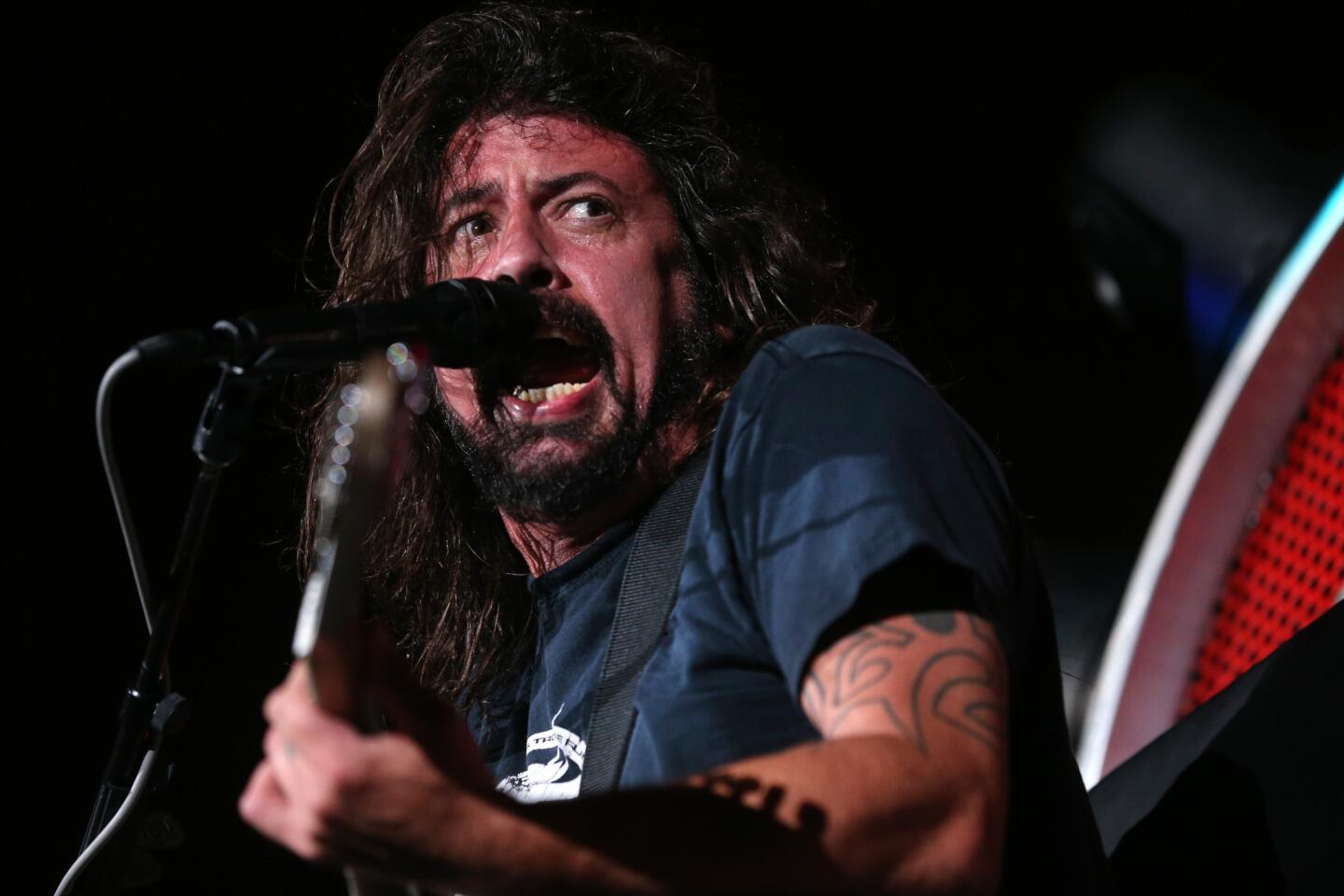 Dave Grohl leads the band Foo Fighters during a concert at Wrigley Field in Chicago on Saturday, August 29, 2015.
