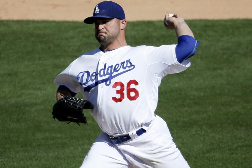 Adam Liberatore makes a relief appearance during an exhibition game on March 8.