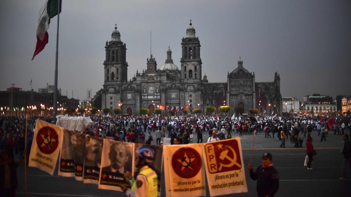 People gather Jan. 31 at El Zocalo square in Mexico City during a protest against a gasoline price increase and U.S. President Donald Trump's plan of building a wall on the border.