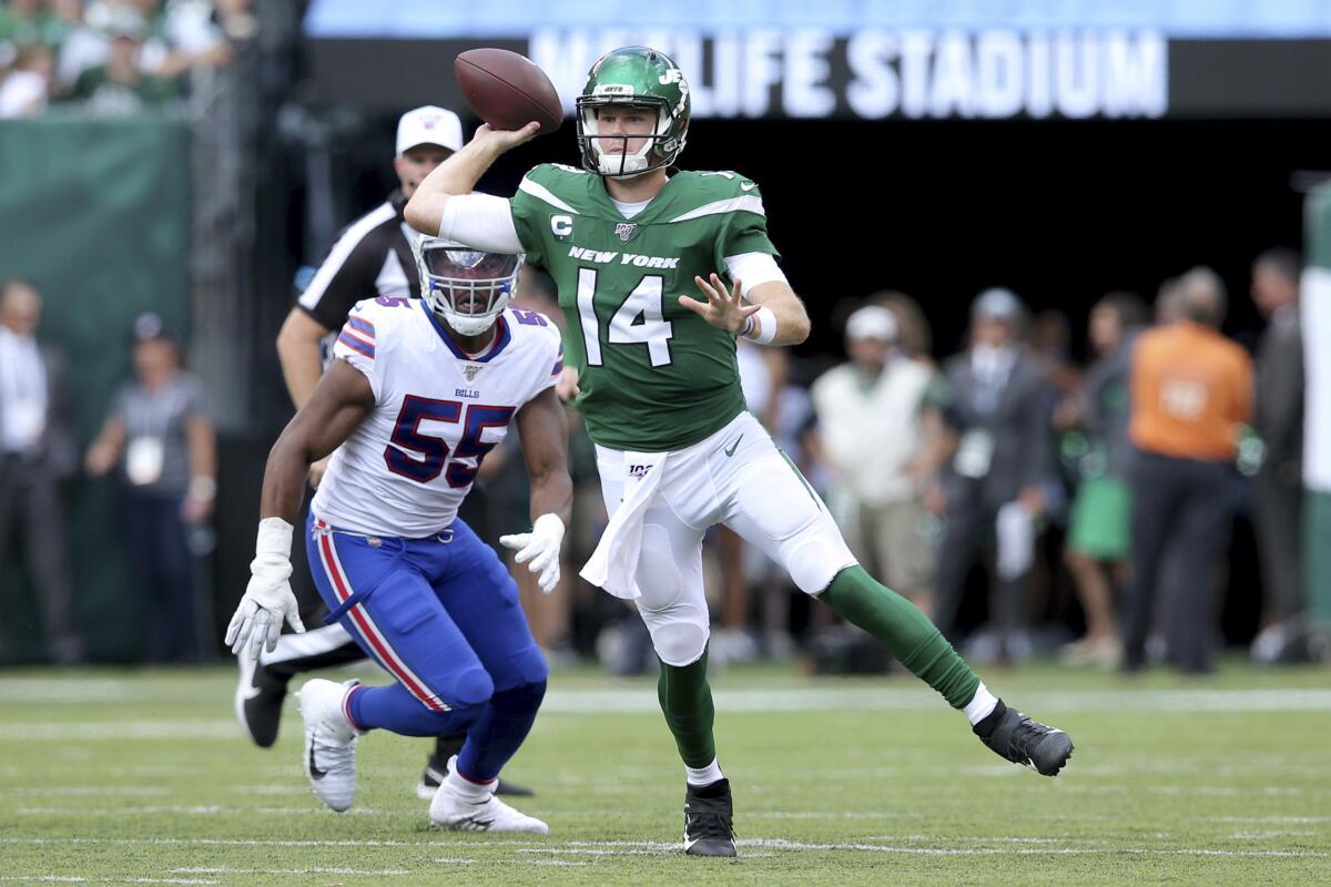 New York Jets quarterback Sam Darnold (14) in action against Buffalo Bills defensive end Jerry Hughes (55) during an NFL football game on Sunday, Sep. 8, 2019, in East Rutherford, N.J. (Brad Penner/AP Images for Panini)