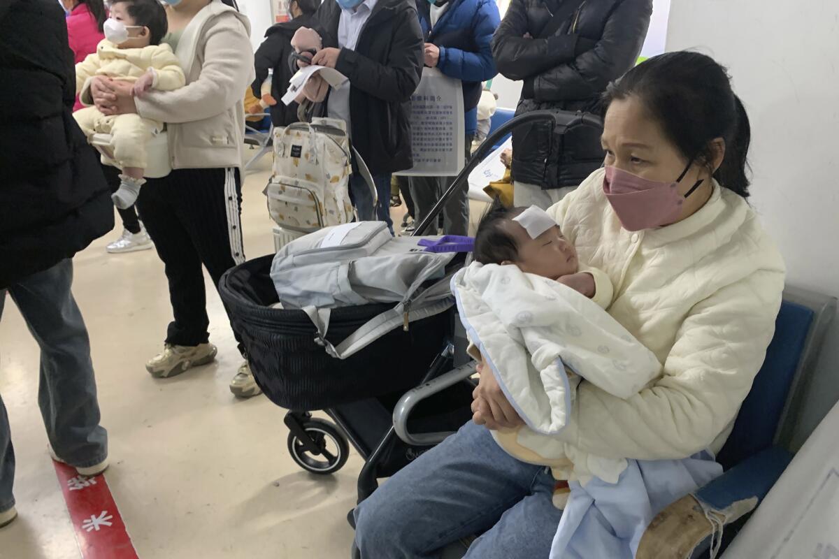 People at a fever clinic of a children's hospital in Beijing
