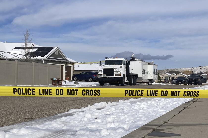 Police continue their investigation at a home where eight family members were found dead in Enoch, Utah, Thursday, Jan. 5, 2023. Officials said Michael Haight, 42, took his own life after killing his wife, mother-in-law and the couple's five children. (AP Photo/Sam Metz)
