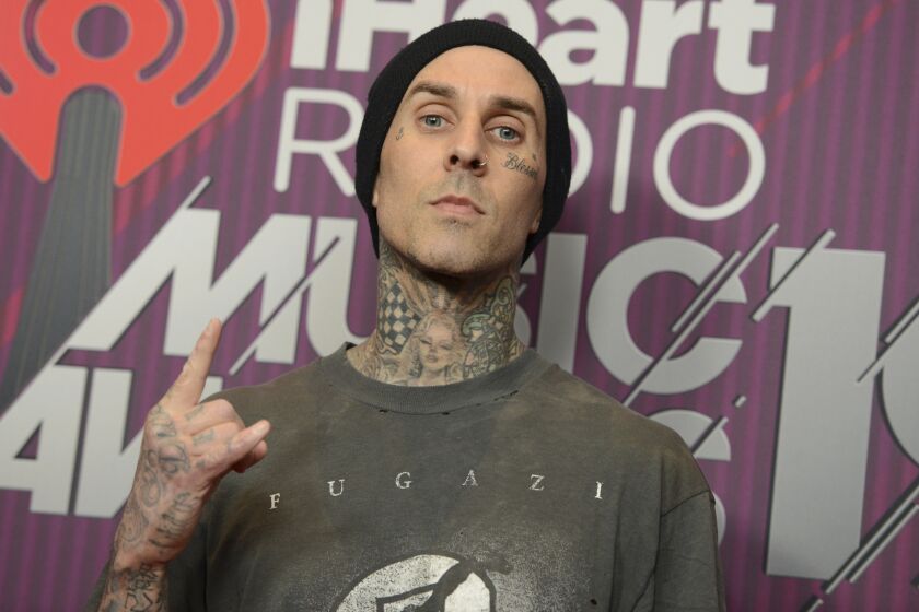 Travis Barker poses in the press room at the 2019 iHeartRadio Music Awards