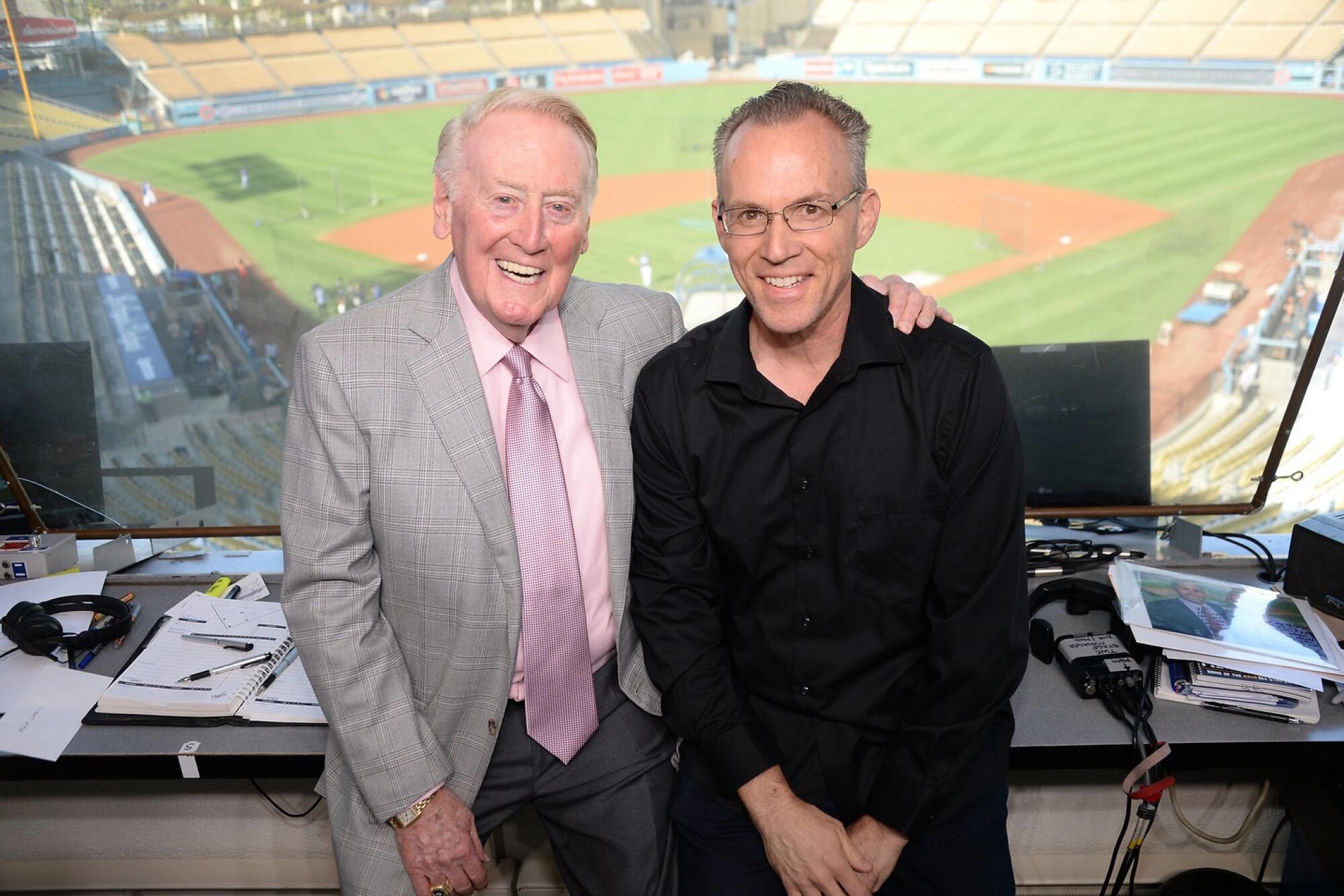 Legendary Dodgers broadcaster Vin Scully, left, and Dodgers historian Mark Langill pose for a photo together.