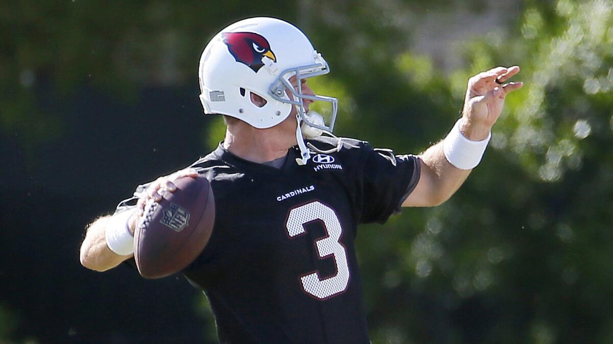 Arizona Cardinals quarterback Carson Palmer takes part in a training drill with the team on Tuesday.