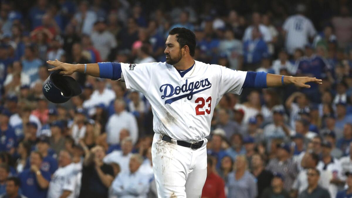 Dodgers runner Adrian Gonzalez is convinced he's safe after he is tagged out at home by Cubs catcher Willson Contreras in the second inning of Game 4 on Oct. 19.