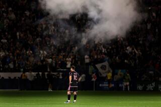 Inter Miami's Lionel Messi watches as the Galaxy celebrate scoring a goal at Dignity Health Sport Park Sunday. 