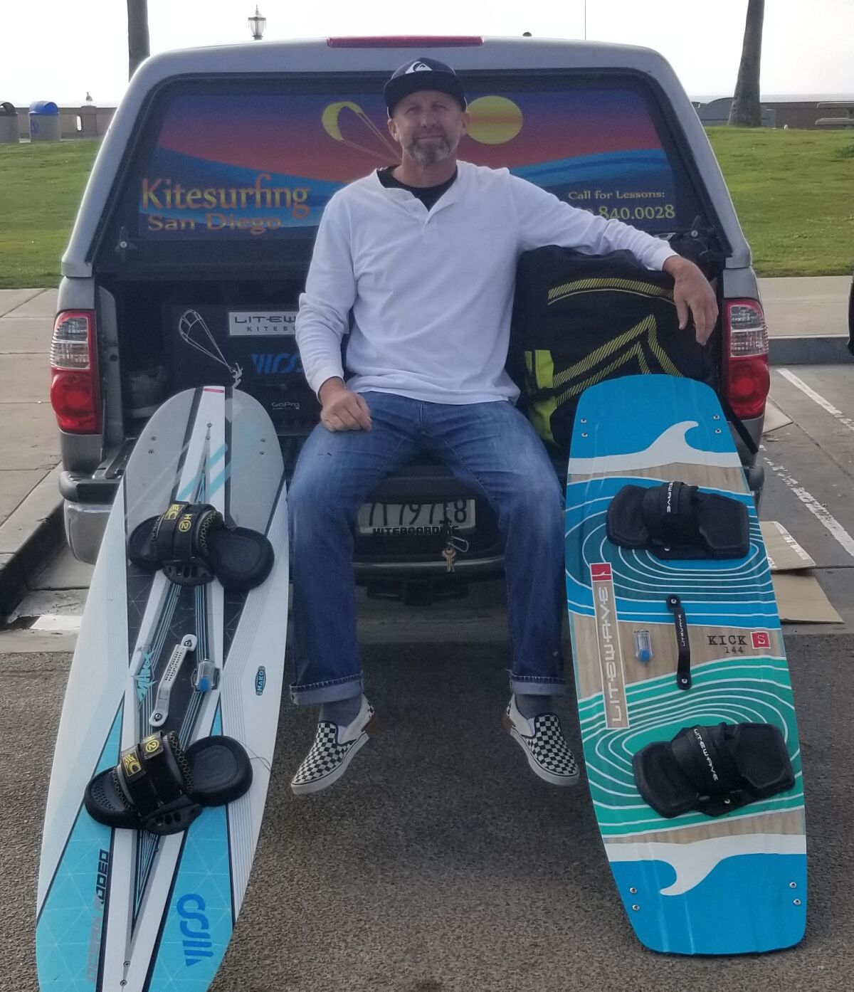 Jeff Raney poses with his kitesurfing gear at Belmont Park.