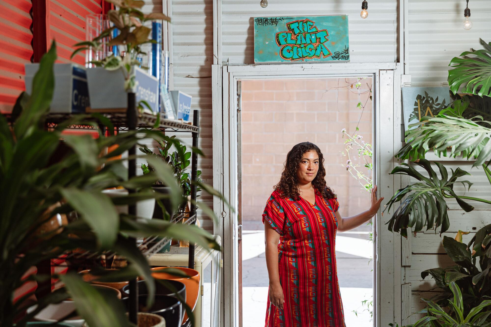  Sandra Mejia stands in the doorway of Plant Chica.