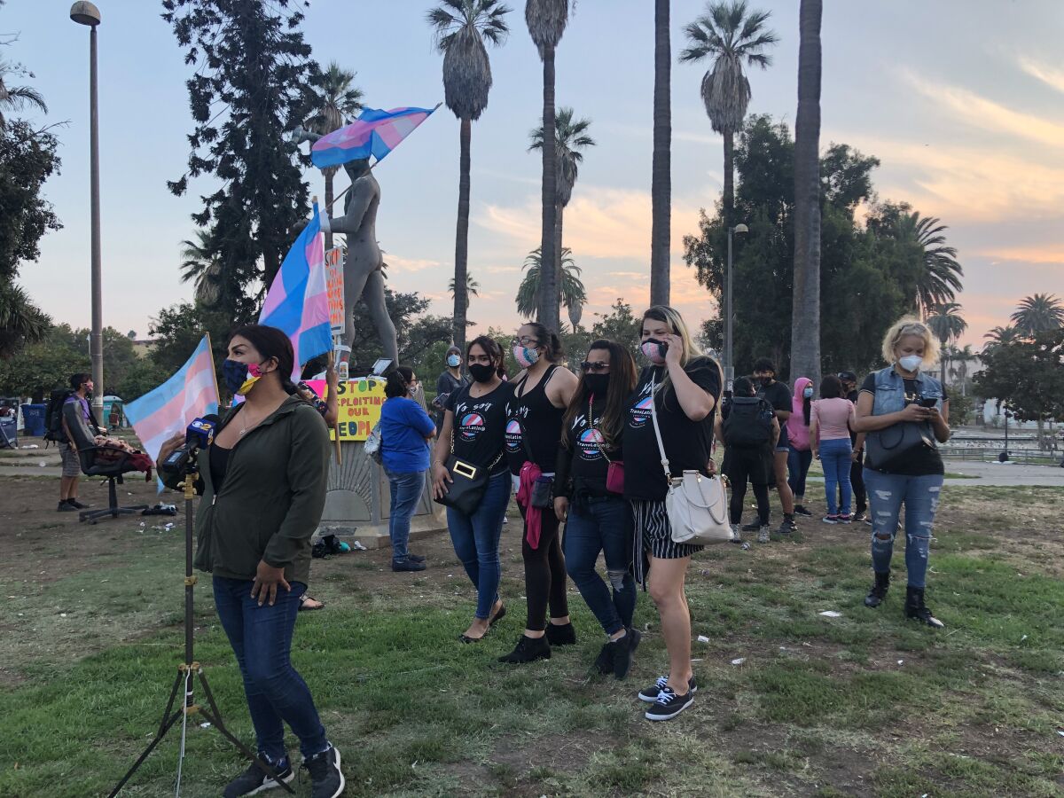 People gather in MacArthur Park on Monday evening to honor Daniela Hernandez, a transgender woman who was attacked Sunday.