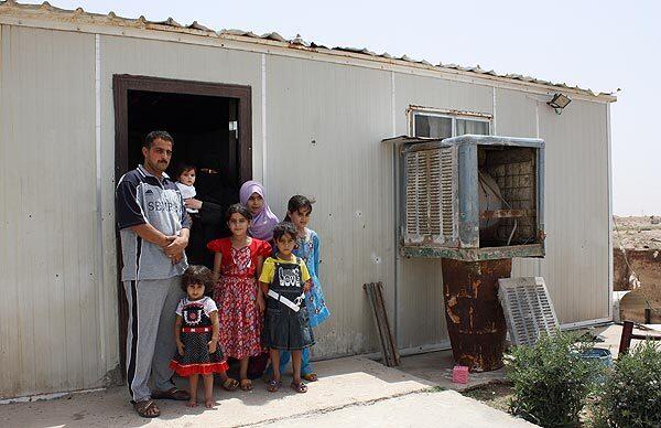 Munir Ibrahim Ismail and his family live on the outskirts of Fallouja, in a trailer home converted from a U.S. military latrine.