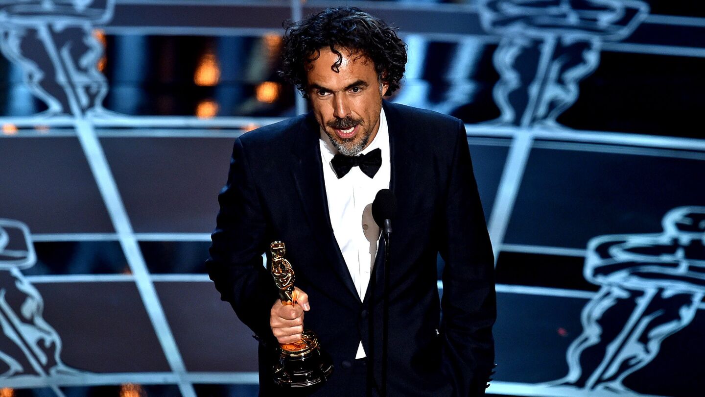 Director Alejandro G. Inarritu accepts the directing Oscar for "Birdman."