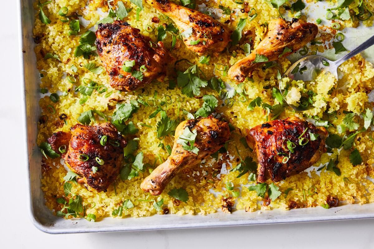 Sheet pan turmeric chicken with crispy rice, cooked on a sheet pan.