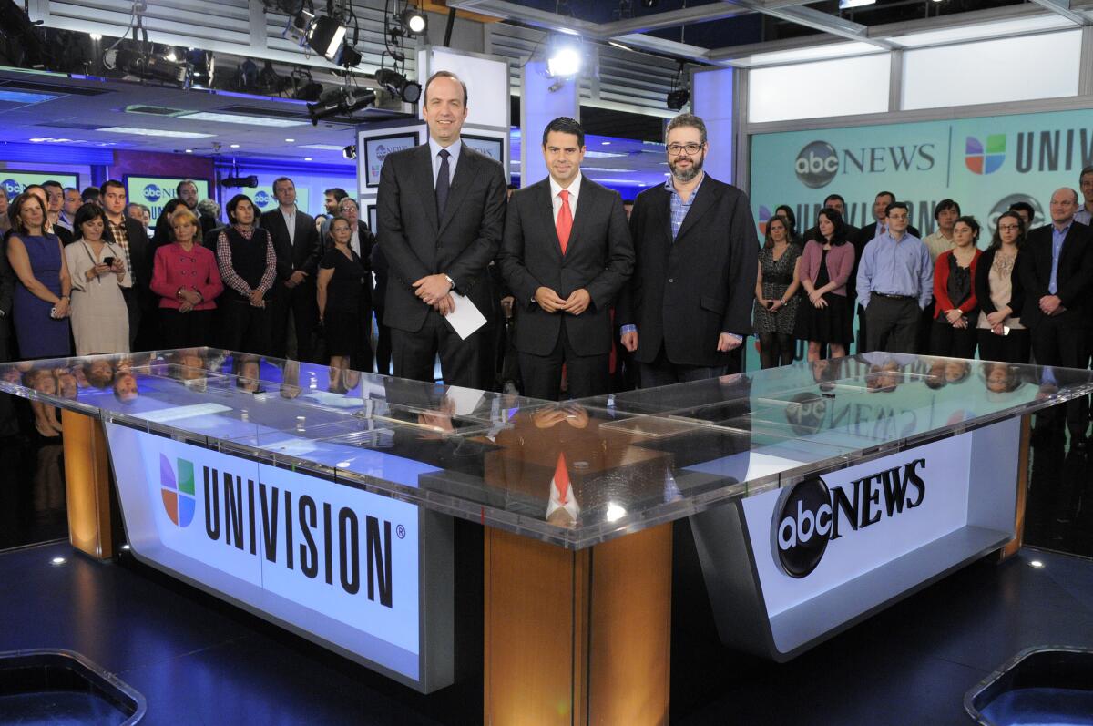 ABC News President Ben Sherwood, from left, Univision Networks President Cesar Conde and Univision News President Isaac Lee in 2012.