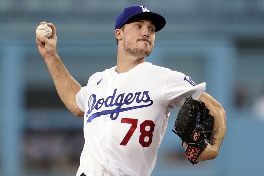 Los Angeles Dodgers starting pitcher Michael Grove throws to a Colorado Rockies.