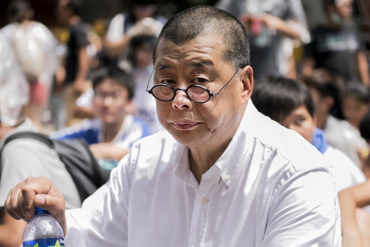 Media tycoon Jimmy Lai, shown last September attending a protest near the government headquarters in Hong Kong, was among those arrested Friday.