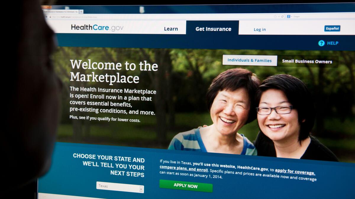A woman looking at the HealthCare.gov insurance exchange internet site in Washington, D.C.
