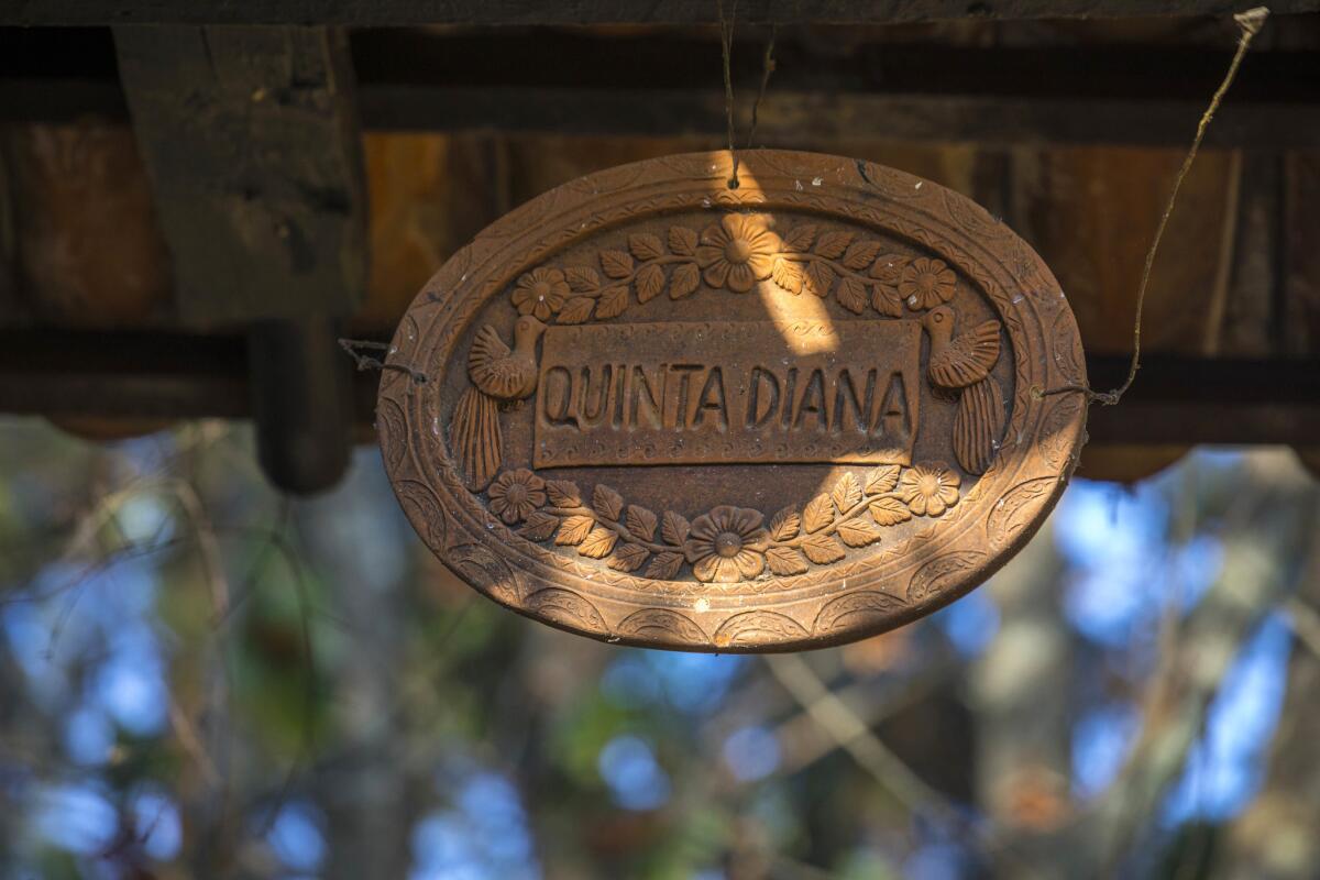 Ceramic sign at the entrance gate to the property.