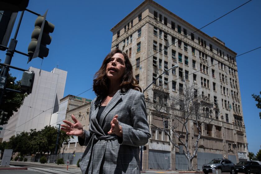 San Diego, CA - April 27: San Diego City Attorney Mara Elliott speaks to members of the media outside the California Theatre building on Thursday, April 27, 2023 in San Diego, CA.The city is suing the owner of the property to remedy all municipal code violations or allow the city to do so at the owner's expense. Adriana Heldiz / The San Diego Union-Tribune)