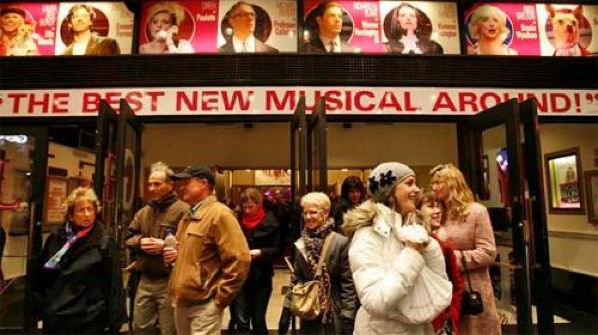 LIGHTS UP: A crowd leaves the theater after a performance of "Legally Blonde" in New York on Thursday night. A 19-day strike ending Wednesday cost Broadway an estimated $40 million in losses.