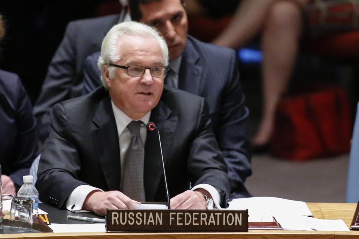 Russia's ambassador to the U.N., Vitaly Churkin, shown here during a Security Council session in July, signaled Sept. 10 that the Kremlin has dropped its objections to an investigation aimed at identifying the perpetrators of chemical weapons attacks in Syria.