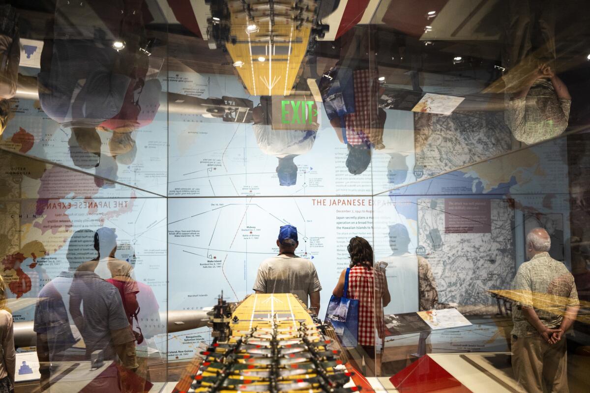Visitors wander around the museum at the World War II Valor in the Pacific National Monument.