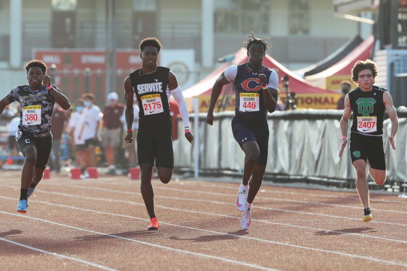 ARCADIA, CA - MAY 8, 2021: Chaminade Patrick Ize-Lyamu Jr (446) wins the Men 100 Meter Dash at the Arcadia Invitational Track Meet on May 8, 2021 in Arcadia, California. On the left is Cathedral Steven Marks (380), Servite Max Thomas (2175) and Thousand Oaks Danny Sarisky (24070, right.(Gina Ferazzi / Los Angeles Times)
